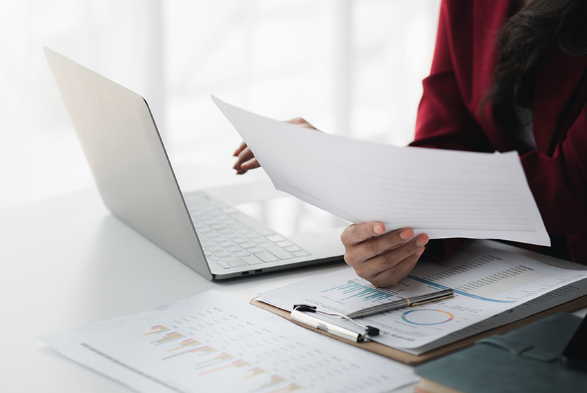 woman reviewing charts and paperwork
