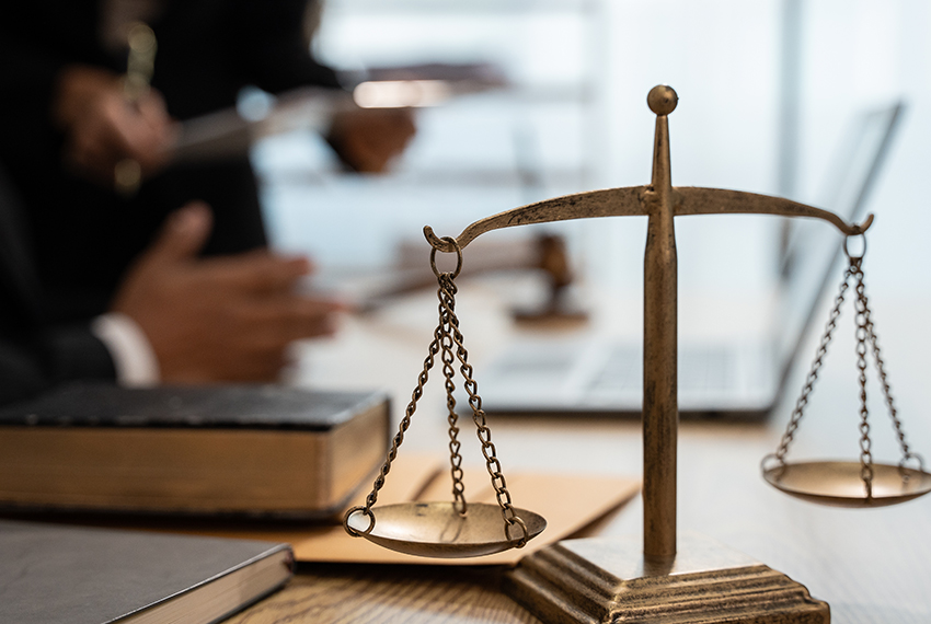 scales and desk with legal work